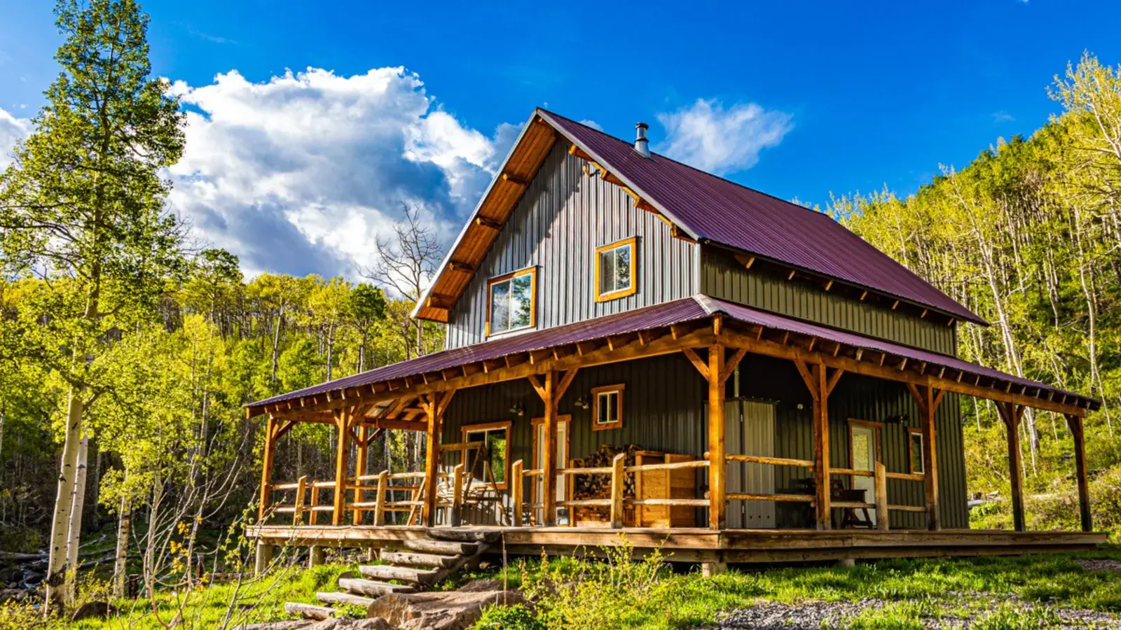 Custom cabin with wraparound porch by One Stop Construction in Duck Creek Village, Utah