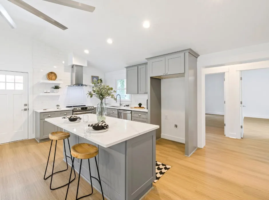 Open-concept kitchen remodel with quartz island by One Stop Construction in St. George, Utah